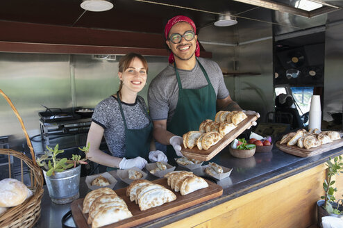 two students making empanadas